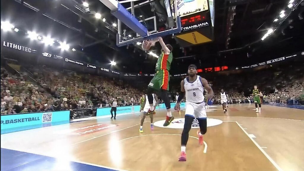 Great Britain defend as Lithuania finish at the rim during the men’s World Cup qualifier in Klaipėda.