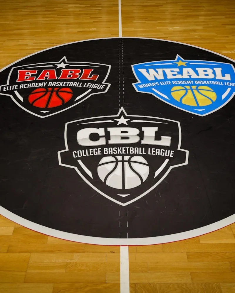 EABL, WEABL and CBL logos displayed on a basketball court