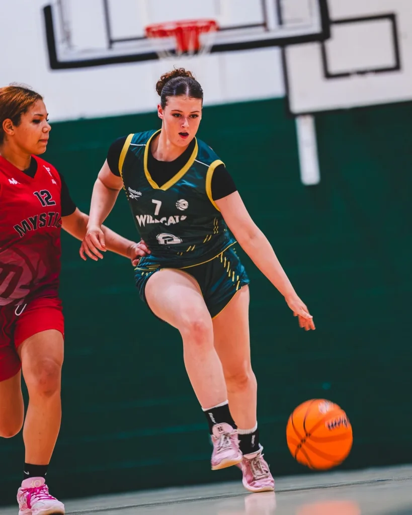 Nottingham Academy Wildcats player dribbles against Manchester Mystics in WEABL action